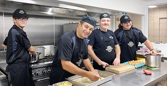 NZFN Food Hub, Good Neighbor, kitchen staff making food.