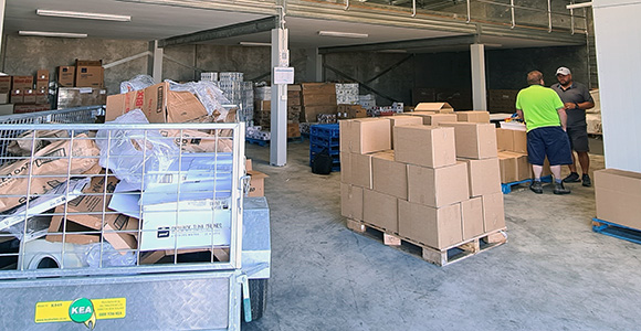 NZFN Food Hub, Te Pataka Blenheim, warehouse with staff in background.