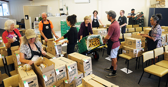 NZFN Food Hub, Kai With Love, staff packing food parcels.