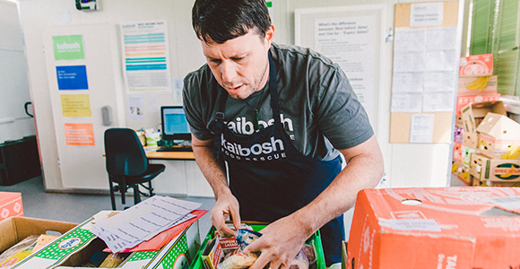 NZFN Food Hub, Kaibosh Food Rescue, staff making a food parcel.