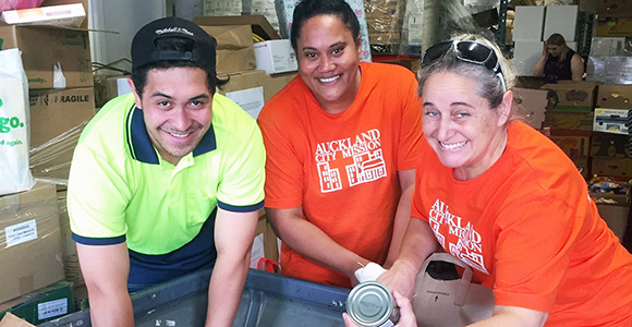 NZFN Food Hub, Auckland City Mission, staff making food parcels.