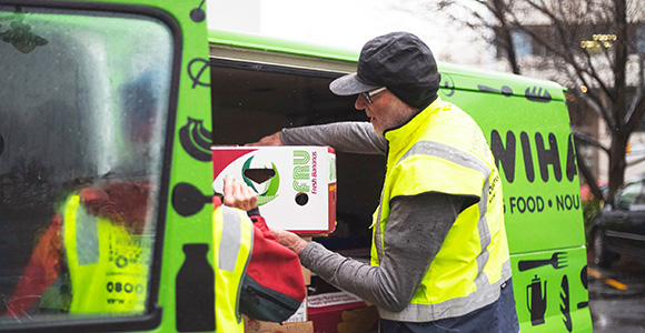 NZFN Food Hub, KiwiHarvest, staff unloading a delivery from their van.