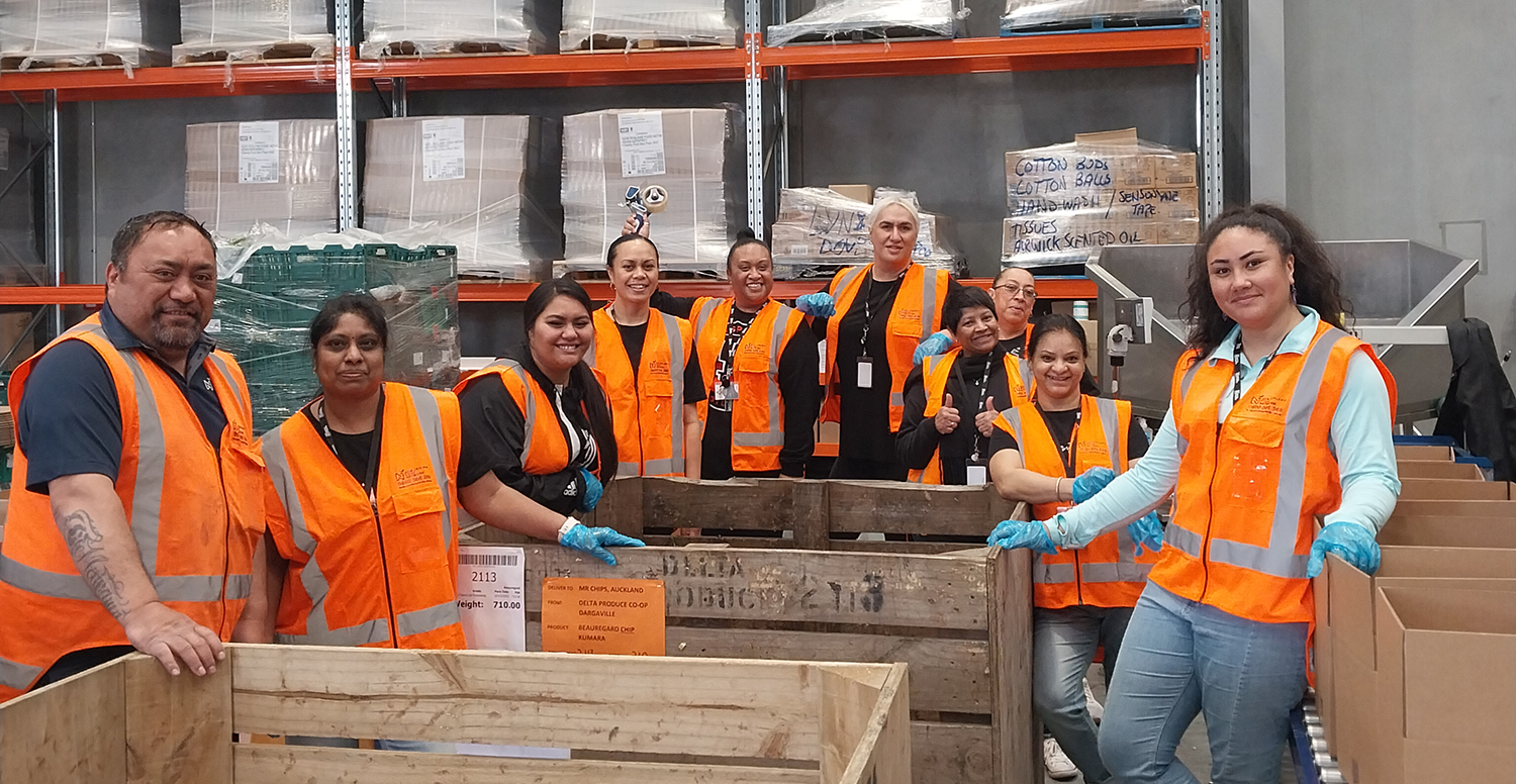 Volunteers from Auckland Council and NZFN staff in NZFN warehouse.