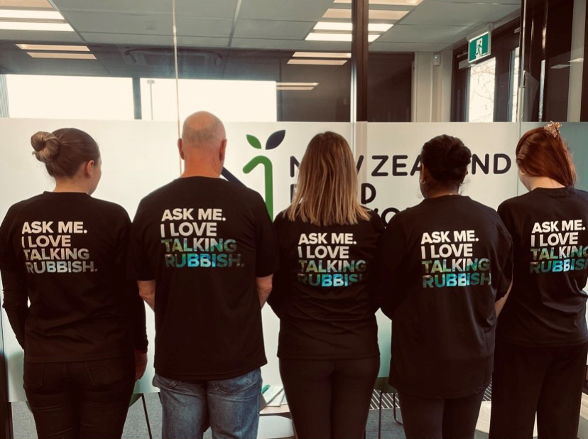 partner01 Enviro NZ volunteers in the NZFN office wearing branded T-shirts.