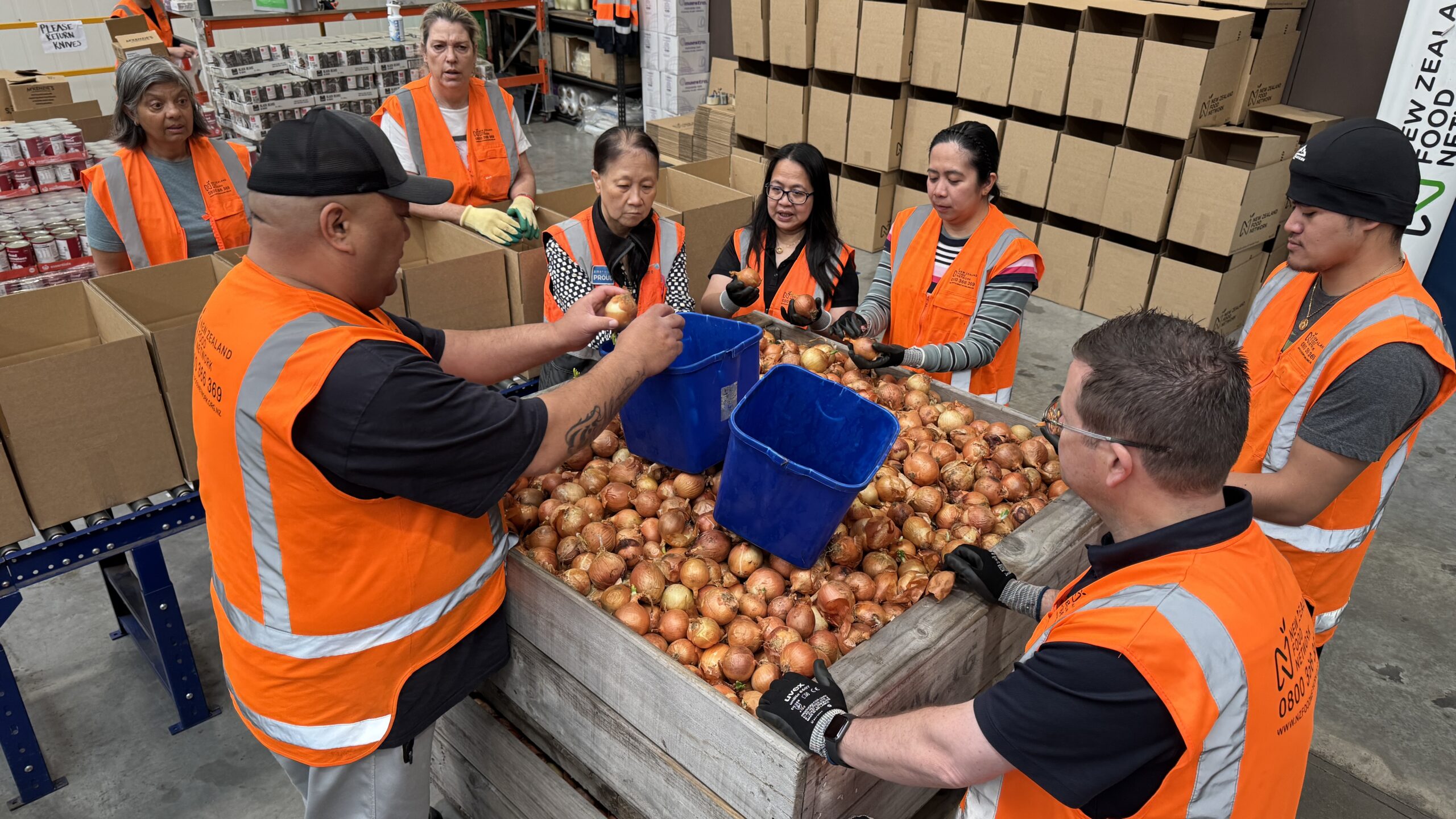 Volunteers from Americold being inducted to a volunteer shift at NZFN's Auckland Warehouse